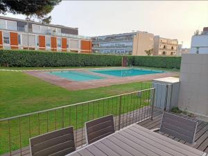 a view of a swimming pool in a building at Pacos Beach House in Lavra