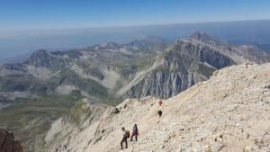 a group of people standing on top of a mountain at La Tana della Volpe in Tempera +2 photos