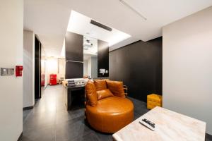an office with a leather chair and a desk at Yeoksam Lumiere Hotel in Seoul +86 photos
