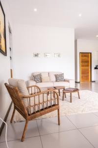a living room with a couch and a table at Bantaskine Apartments in Paramaribo