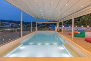 a swimming pool in the middle of a house at Private Yangyang Dockchae Pool Villa in Yangyang