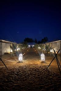 a wedding reception in a marquee at night at Sahara Luxe Camp in Merzouga