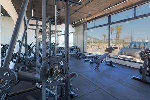 a gym with cardio equipment and a view of the desert at Designer Villa with BBQ & Heated Pool on Santa Rosalia Lake Resort in Torre-Pacheco