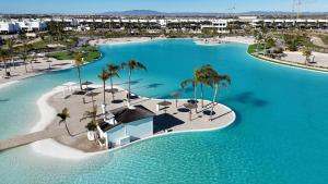 an aerial view of a resort with a swimming pool at Designer Villa with BBQ & Heated Pool on Santa Rosalia Lake Resort in Torre-Pacheco