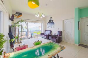 a living room with a pool table in it at Namhae arahil pension in Namhae