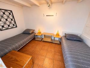 a living room with two couches and a table at Casa de Hollanda in Sidi Ifni