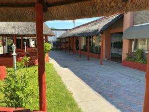 a walkway in front of a building at Punyu International Hotel 