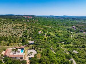 an aerial view of a house with trees at My Dalmatia - Hilltop Paradise with private pool, sauna and Jacuzzi in Kula Atlagić +69 photos