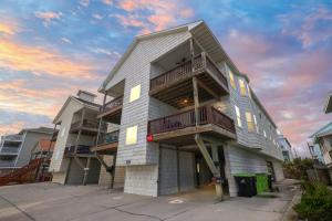 a building with balconies on the side of it at 3 BDR, Oceanview's, Walk to Pier in Carolina Beach