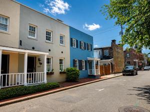 a row of houses on a city street at Coach`s Corner in Savannah