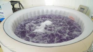 a machine filled with purple fluid in a room at Yeosu Maru Pension in Yeosu