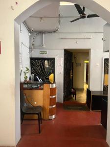 a room with a desk and a chair in a room at Ecovilla luxury in Pondicherry