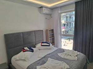 a bedroom with two beds with towels on them at D&D hotel in Shëngjin