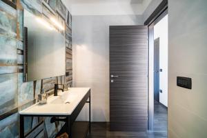 a bathroom with a sink and a mirror at La Quintessenza in Monopoli +77 photos