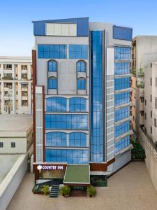 an overhead view of a building with blue windows at Country Inn Smart Stays, Patna in Patna