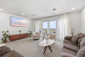 a living room with a couch and a table at Coliseum Ocean Resort in Wildwood Crest