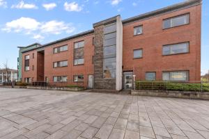 an empty parking lot in front of a brick building at Castle View in Stirling