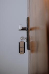 a lock on a door with a price tag on it at Blue9 Hotel in Jaffna