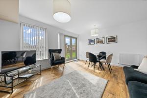 a living room with a couch and a table at Castle View in Stirling