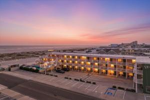 an aerial view of a hotel with the beach at Coliseum Ocean Resort in Wildwood Crest