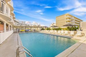 an image of a swimming pool at a resort at Coliseum Ocean Resort in Wildwood Crest