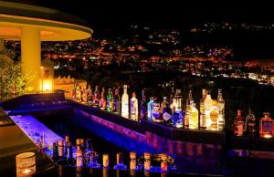 a bar with a lot of bottles of alcohol at Kalkan Regency in Kalkan