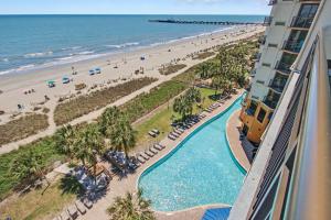 a view of the beach from the balcony of a resort at The Patricia Grand in Myrtle Beach