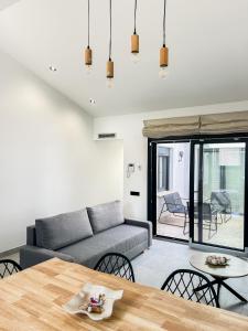 a living room with a couch and a table at Apartamentos llerda in Cretas