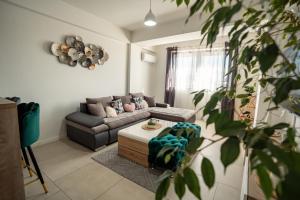 a living room with a couch and a table at Ohrid Pearl Apartment in Ohrid