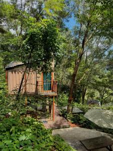 a tree house in the middle of a forest at DeBay Retreat - Little Đà Lạt Chill Villa in Sóc Sơn