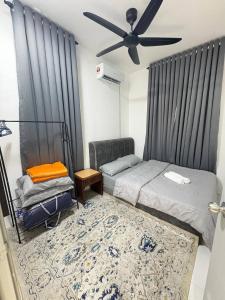 a bedroom with two beds and a ceiling fan at Arowana Homestay MALAY ONLY in Sungai Petani
