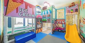 a childrens room with a play area with a slide at Daebudo sunshine kids poolvilla in Ansan