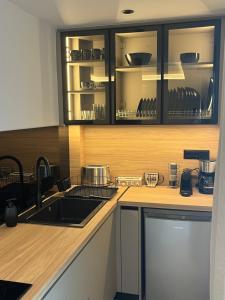 a kitchen with a sink and a counter at Latsis Suites in Moláoi +7 photos