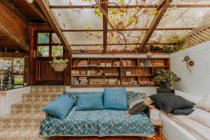 a person laying on a couch in a room at Herzegovina Lodges Boracko Jezero in Konjic