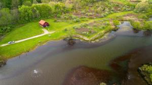 an aerial view of a house next to a river at Fisherman’s Dream in McArthur +30 photos