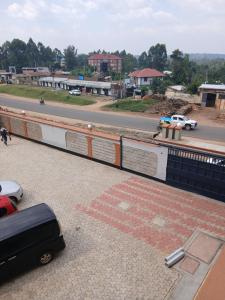 a car is parked on the side of a bridge at Maridadi place in Kakamega