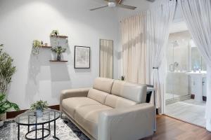 a living room with a couch and a table at Cute Little Condo no 310 in Dallas