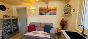 a living room with a couch and a table at Antico Borgo Fonzaso in Fonzaso