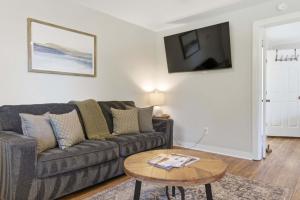 a living room with a couch and a table at Pasture Bedtime in Franklin