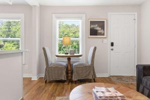 a living room with a table and chairs and a window at Pasture Bedtime in Franklin +10 photos