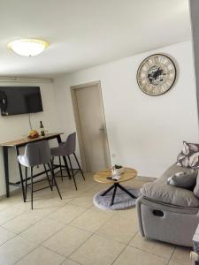 a living room with a couch and a table at Apartman Aurora in Ičići +26 photos