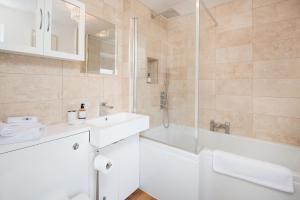 a bathroom with a tub and a sink and a shower at Stucktaymore in Killin +32 photos
