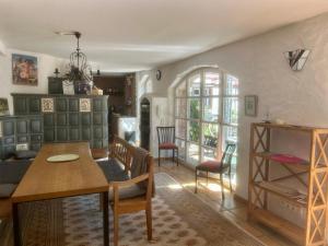 a living room with a table and a dining room at Bergfohlenhof in Höchst im Odenwald