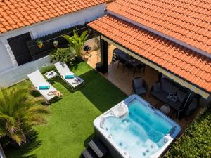 an overhead view of a backyard with a hot tub at Oasis Beach Holiday Home with jacuzzi in Playa del Ingles