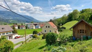 a small village with houses on a hill at Landhaus Rickies in Aifersdorf