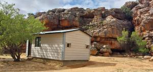 a small building in front of a rocky mountain at Kleinfontein in Clanwilliam
