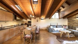 a living room with a couch and a table at Chalet la Segheria in Temù
