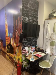 an office with a desk with a chalkboard on the wall at Million Gold Gdańsk in Gdańsk +47 photos