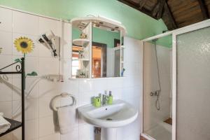 a bathroom with a sink and a shower at Casa Asuncion in Breña Alta +17 photos