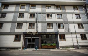 a building with a sign on the front of it at Kütahya Şehir Otel in Kütahya